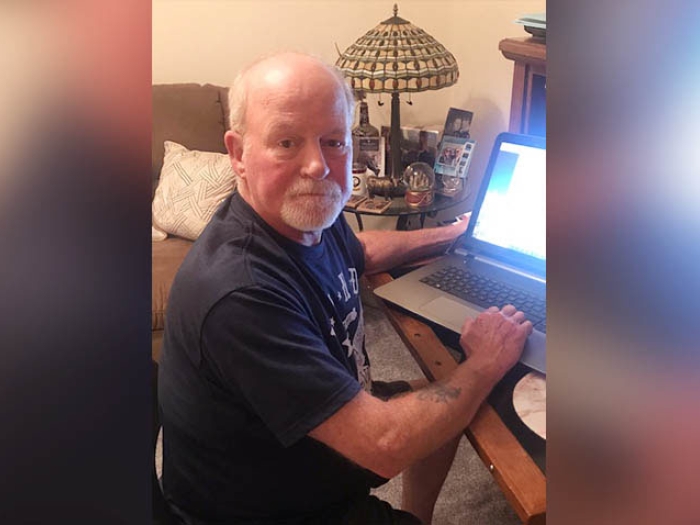 Man in front of computer for telemedicine