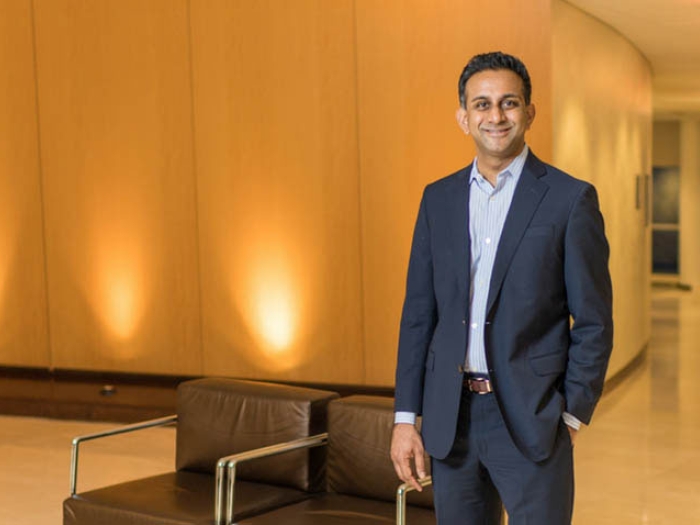Man in suit standing in hallway