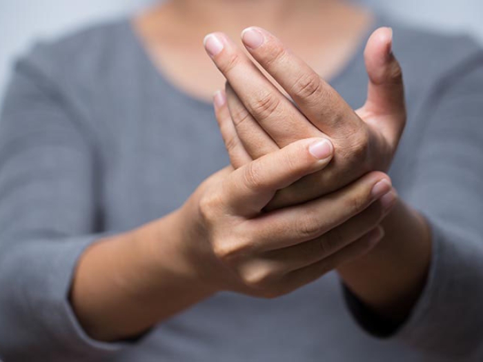 woman holding one hand 