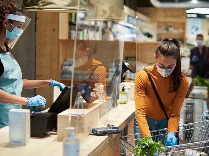 Social distancing checking out at grocery store