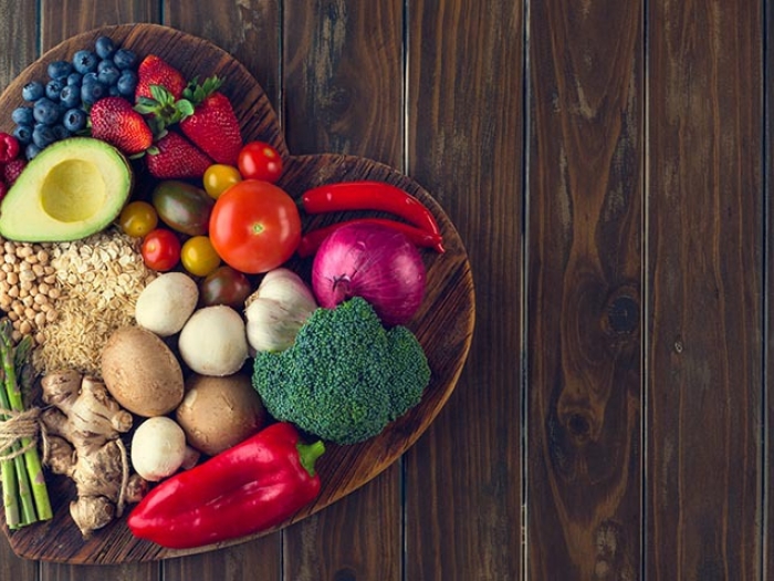 heart shaped bowl with fruits and vegetables 