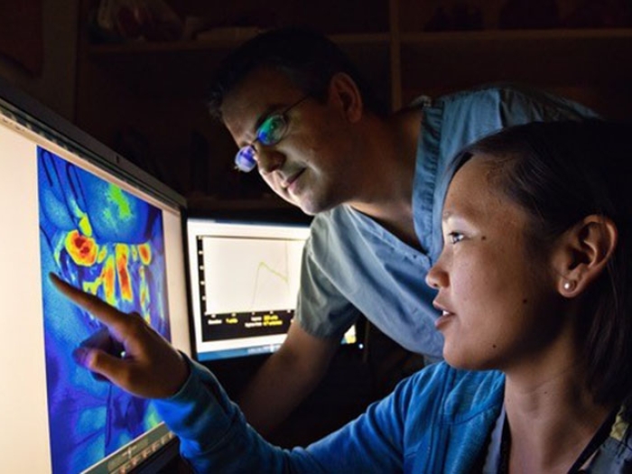 Doctors looking at screen