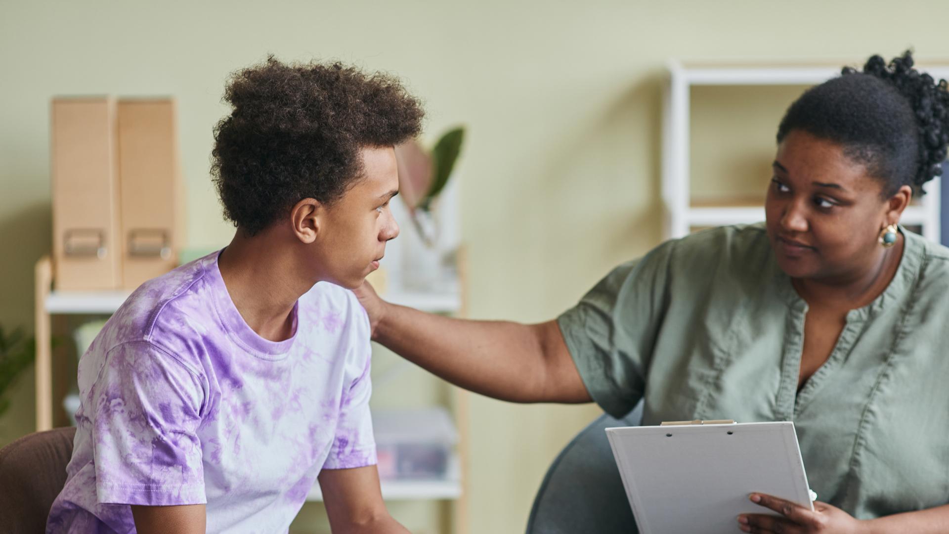 Woman supporting a teenager in need