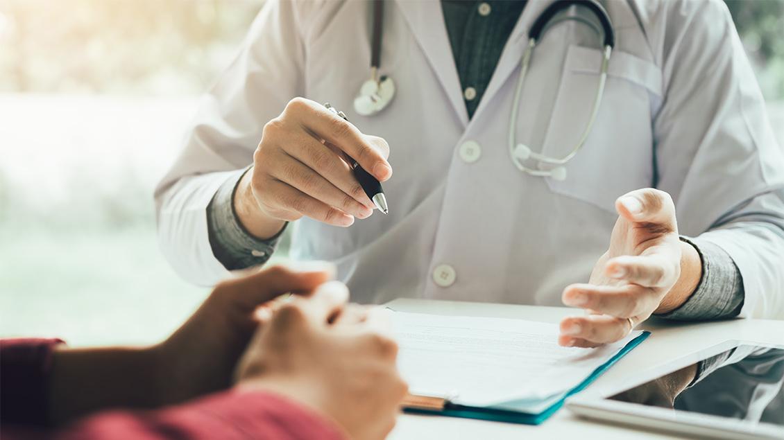 Doctor and patient reviewing paperwork