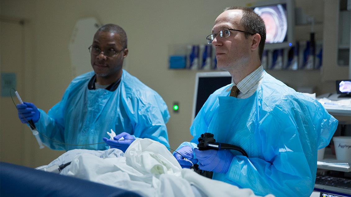 Two doctors performing a procedure