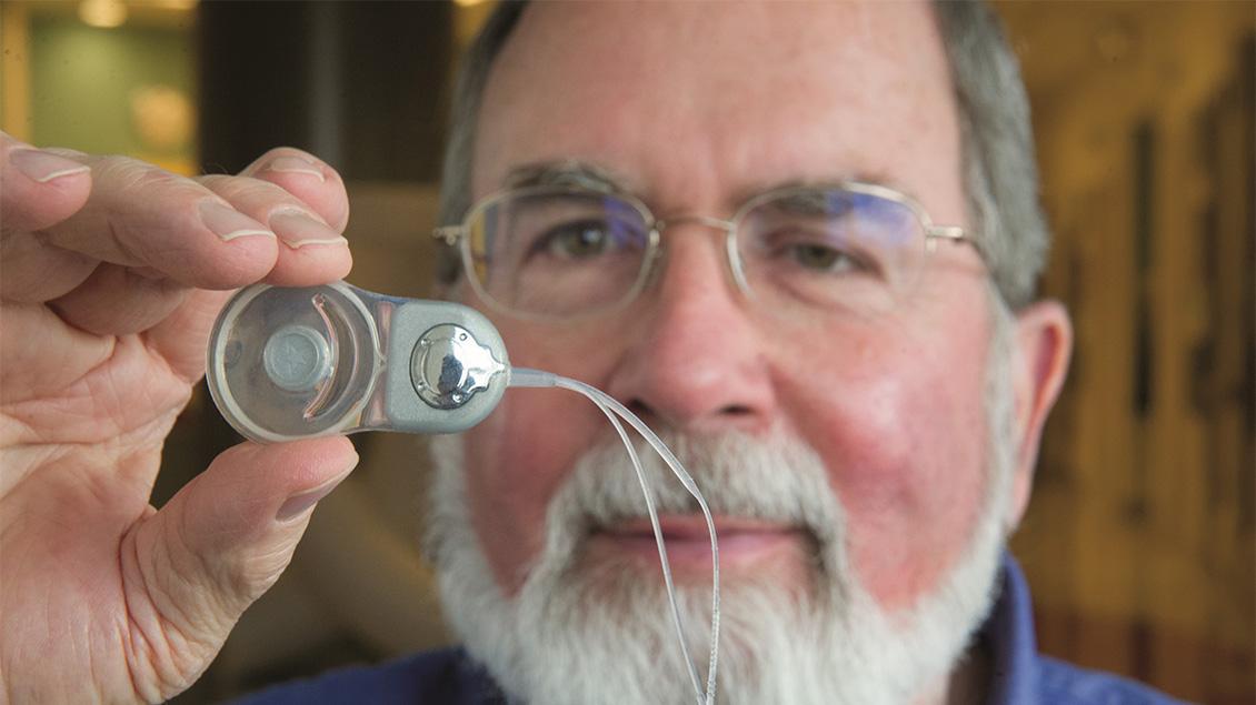 Doctor looking at a medical device