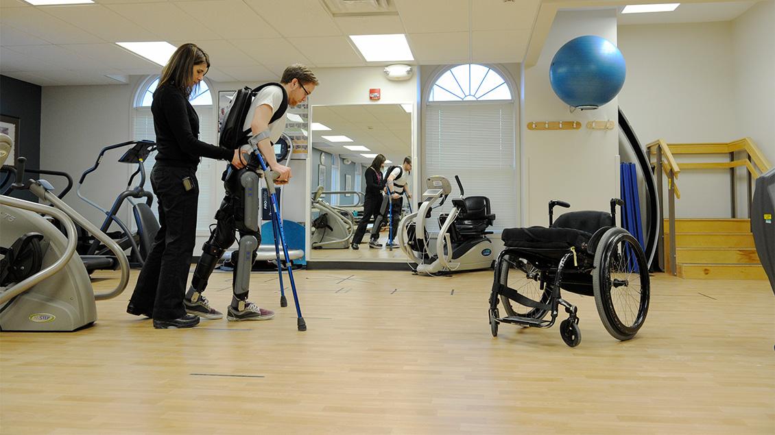 Doctor and patient working on physical therapy