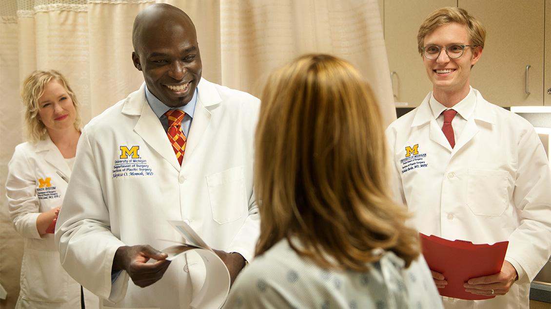 Group of doctors with a patient