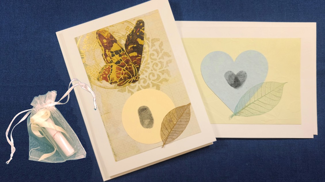 Two cards, one with a butterfly and leaf, one with a heart and leaf