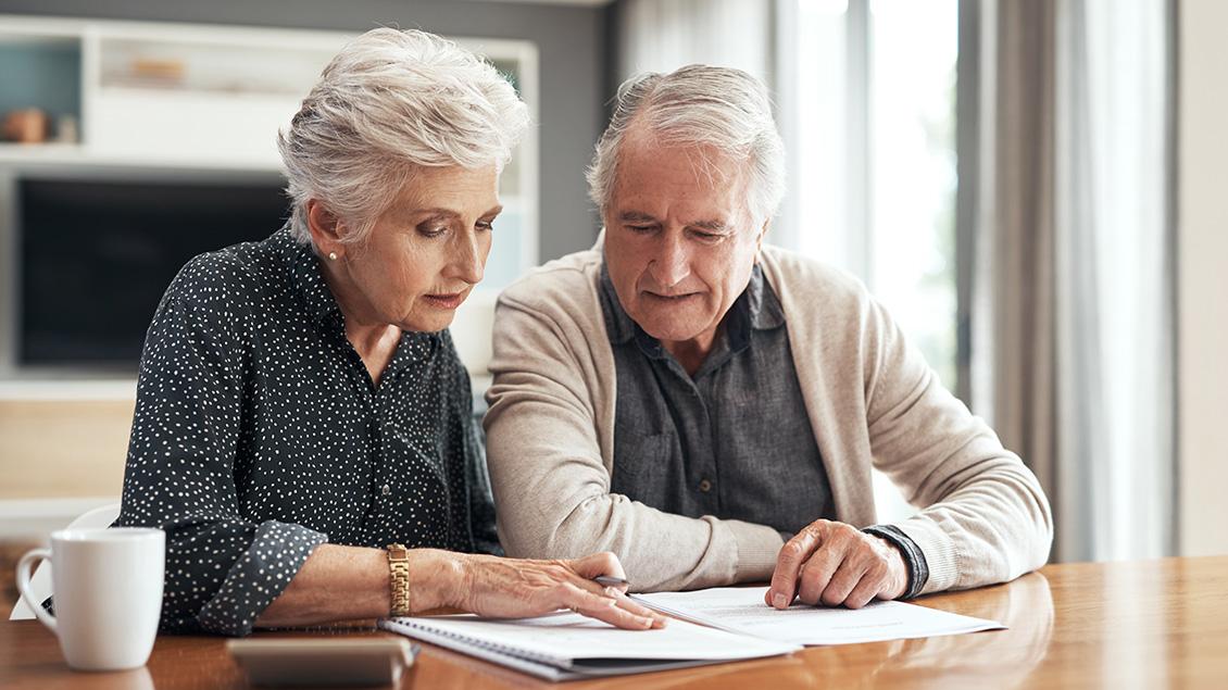 senior couple reviewing financial documents