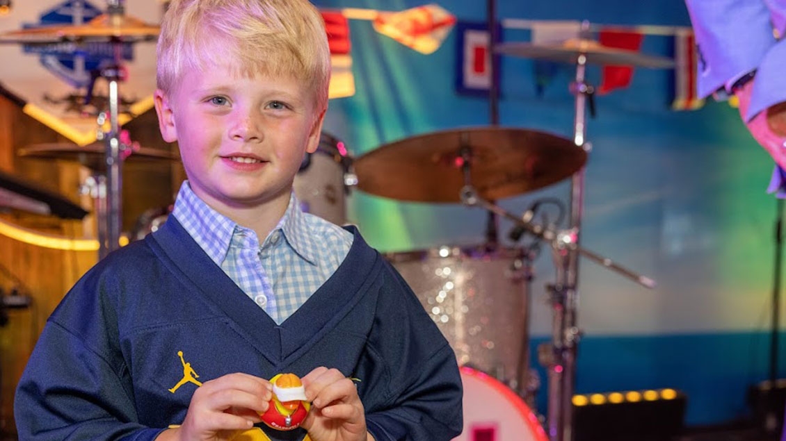 Boy holding a small rubber duck