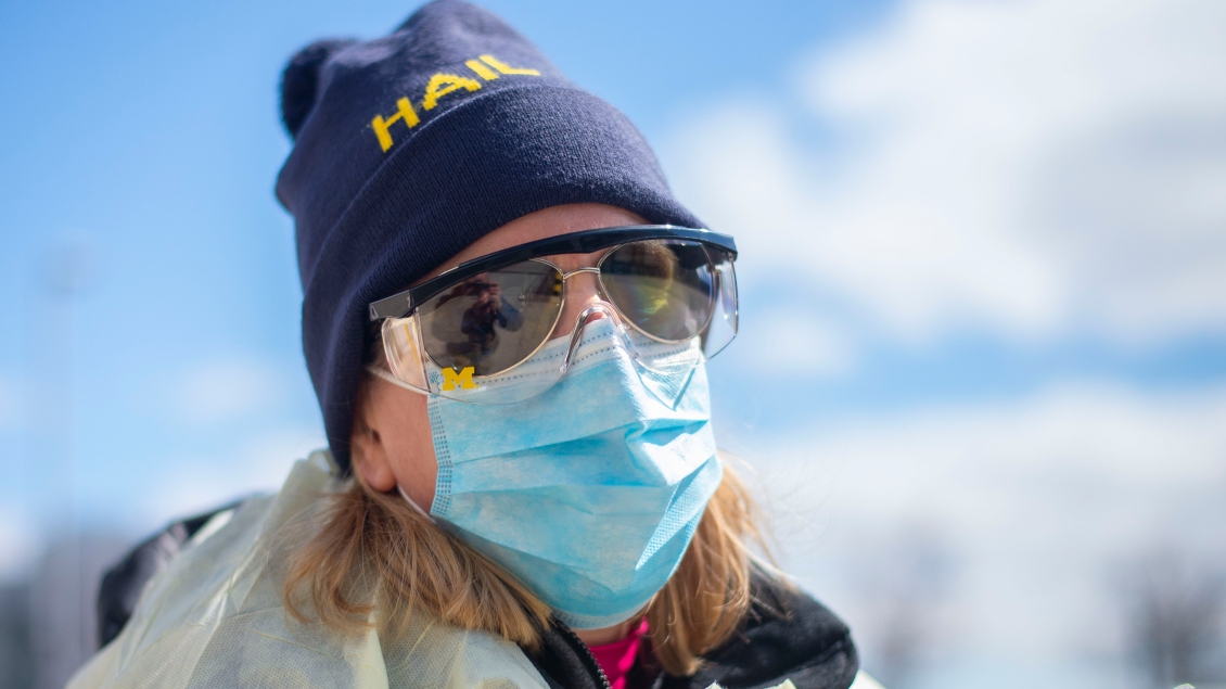 Nurse wearing mask and HAIL hat