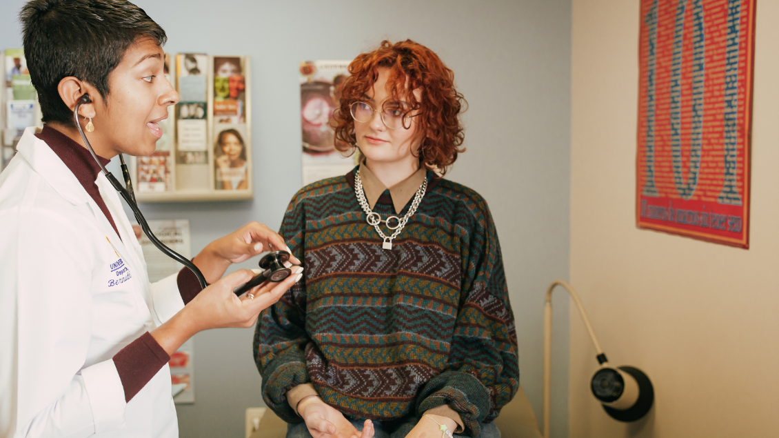 A health care provider talking with a patient