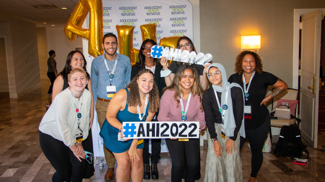 Group picture of the 2021-22 season of TAC TAC at the 2022 Conference on Adolescent Health's step-and-repeat