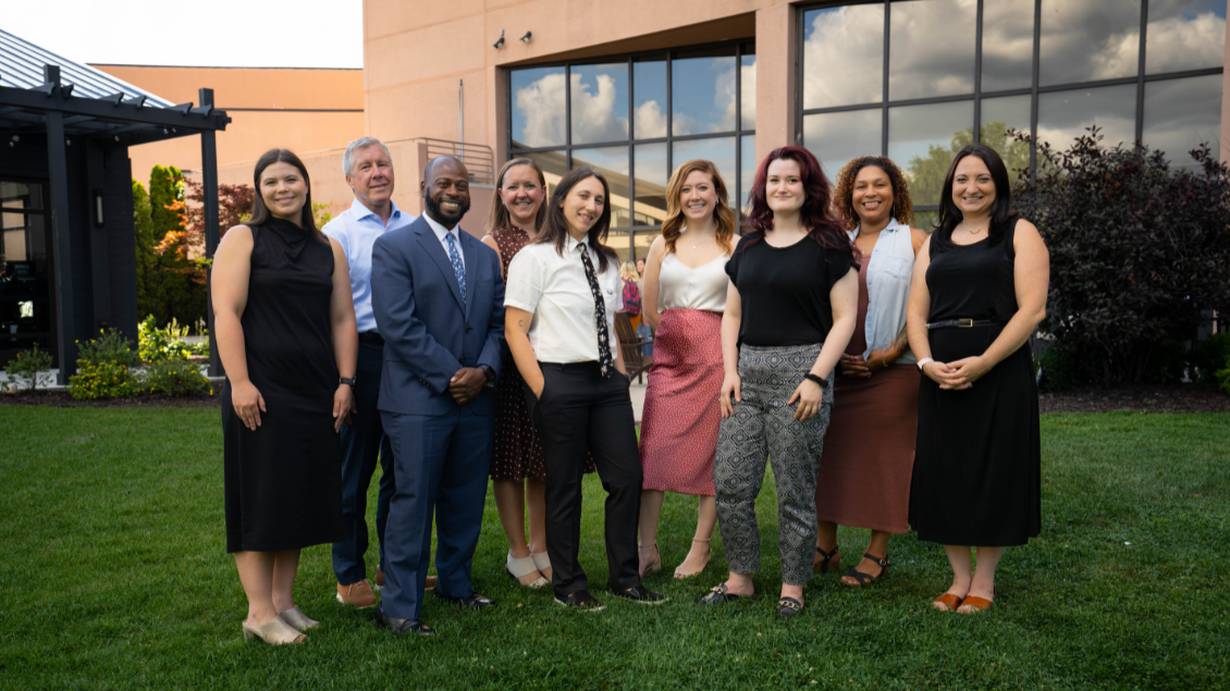 A picture of the AHI Team and co-medical directors posing outside at the 2022 Conference on Adolescent Health