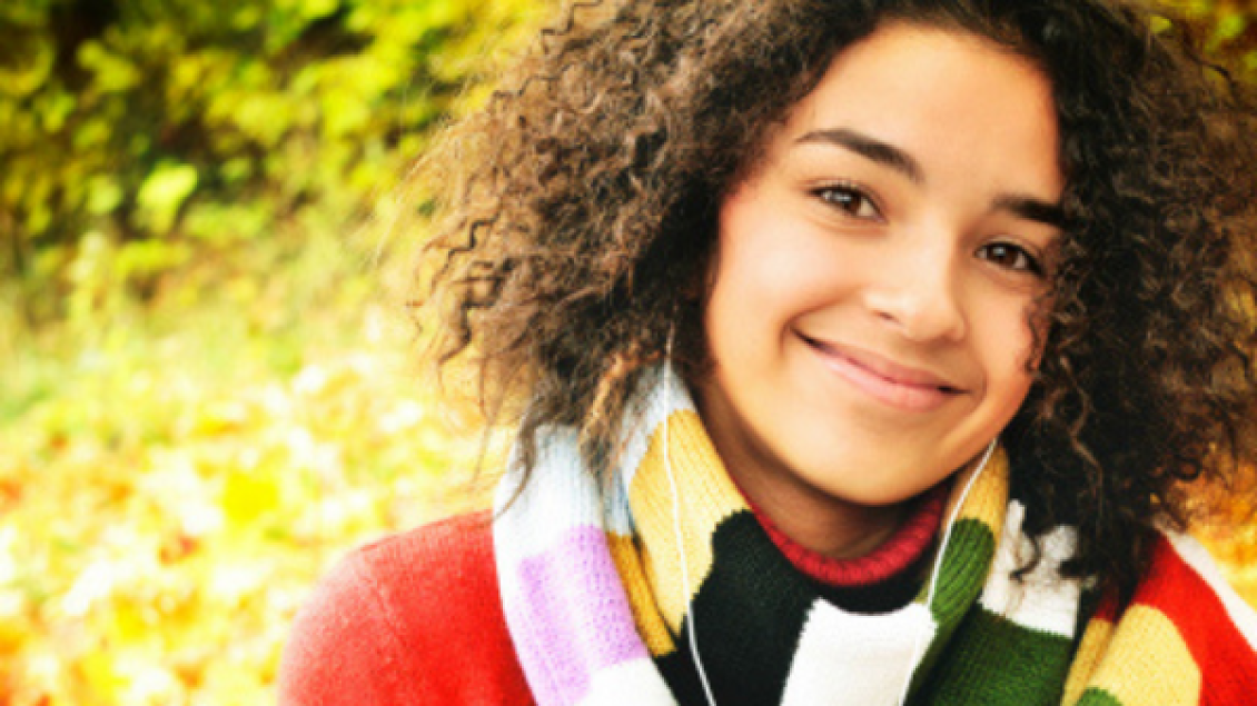 A girl smiles for the camera.