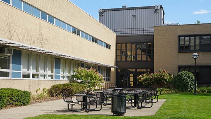 Entrance to OHEI at Michigan Medicine with outdoor tables