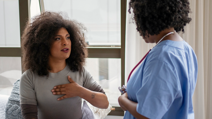 LGBTQ+ individual speaking with a physician