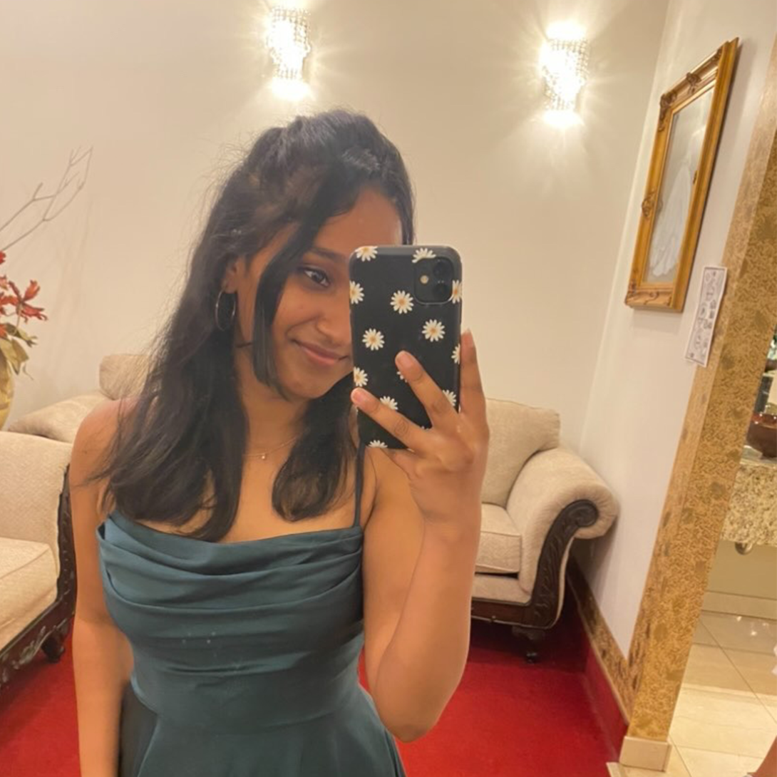 Sri takes a photo of herself