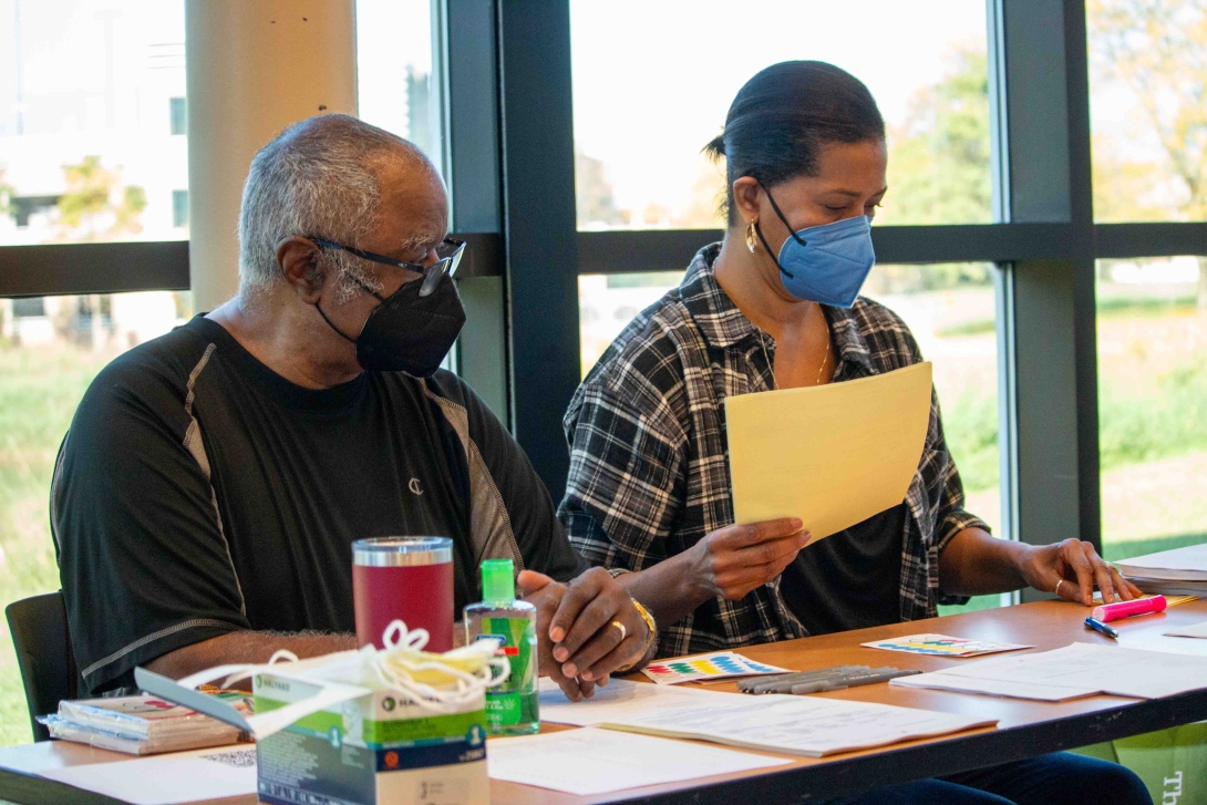 non-clinical volunteers work flu clinic table