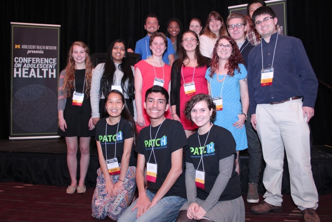 Group of people smiling for the camera.